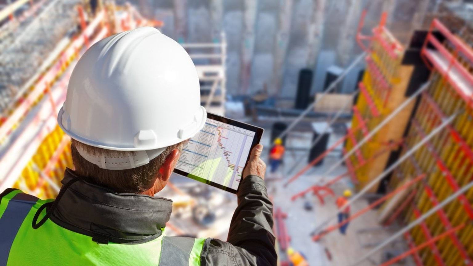 Construction worker looking over a construction site